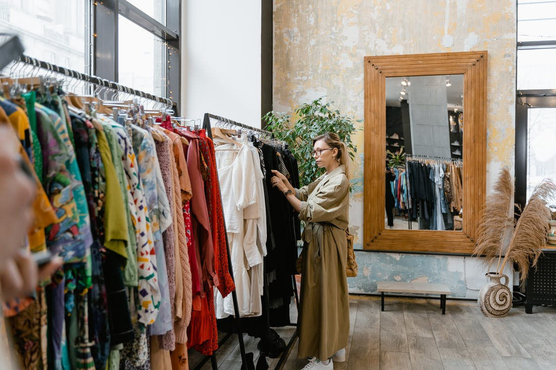 Lady shopping for stylish Turkish clothing in a boutique. 